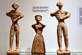 Museo archeologico di Iraklion. Clay female and male figurines in an attitude of worship. Chamezi, 1900-1700 BC.